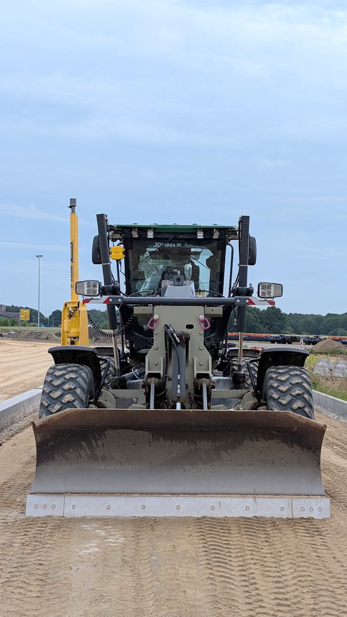 The Art of Drawing Readers In: Your attractive post title goes here Front view of a heavy road grader on a construction site in Werlte.